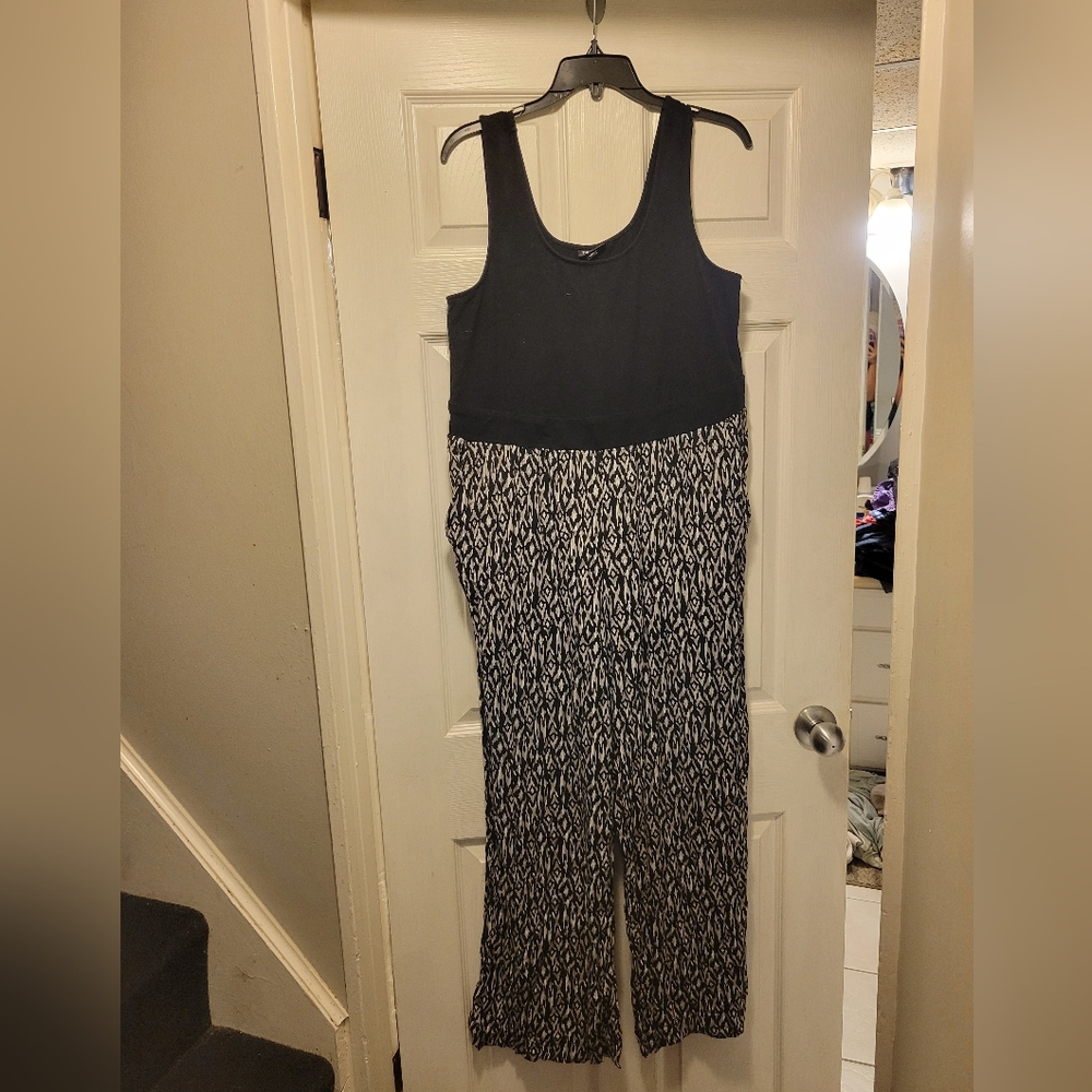 Torrid jumpsuit, muscle shirt top black pants bottom with grey and black size 0